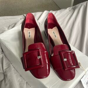 Size 40 1/2 MIU MIU Red Ballerina flats. Has a small heel! Worn a few times!